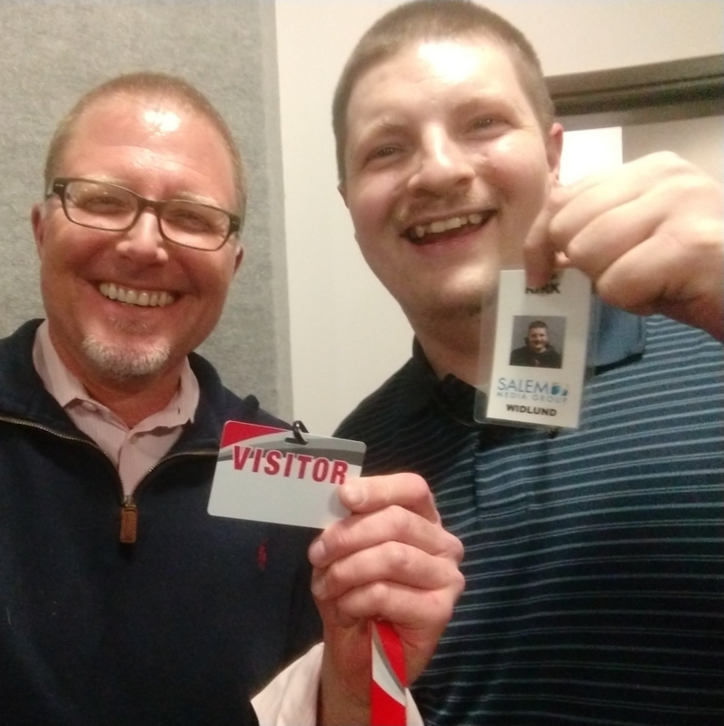 Steffan Tubbs and Kirk Widlund holding badges. Stephan's says "Visitor" and Kirk's says "Salem Media"